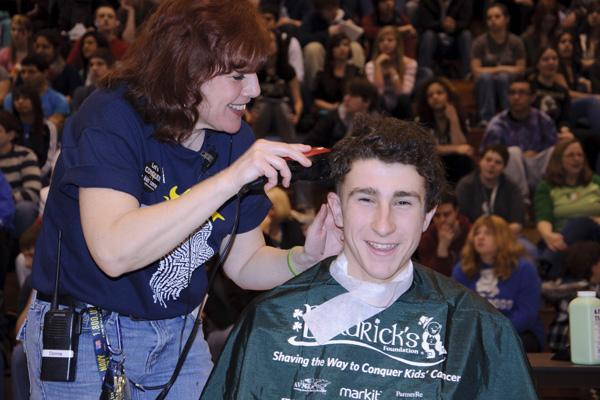 Students and staff shave off hair for cancer research