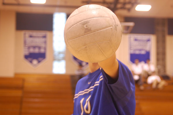 Varsity boys volleyballers leading while freshmen just learning