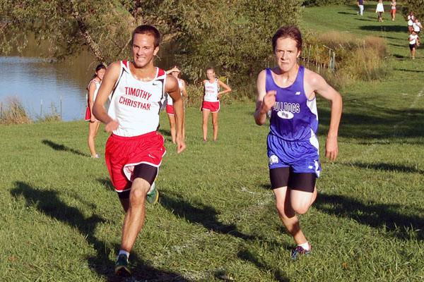 Junior Ian Clark sprints to the finish as he battles with a runner from Timothy Christian