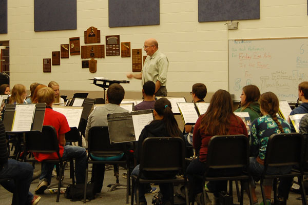 McOlgan had been a teacher at RB for nineteen years. Above, he practices a piece with the Honors Symphonic Marching Band