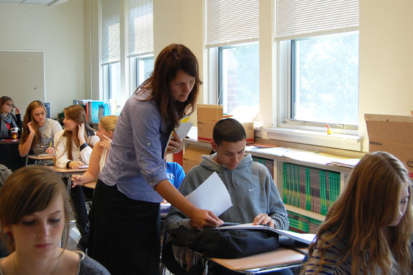 English teacher Bridget Wilmot works with this year's Rouser students.  After the departure of former sponsor Cherise Lopez to Hinsdale Central, Wilmot took on the sponsorship.