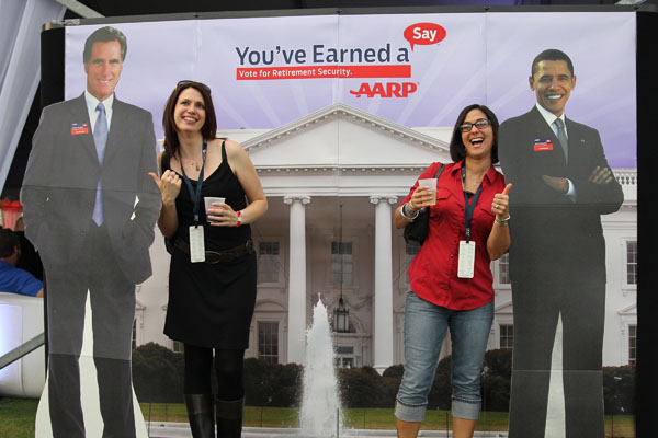 Political ads often don't tell the whole truth about candidates. Above, voters pose with cutouts of the candidates during the debates.