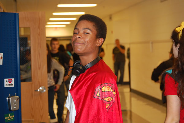 Sophomore Marvin McKenzie shows off his stylish Superman cape for Superhero Monday.  Other Spirit Week days include Decades Tuesday, Sport Wednesday, Endless Summer Thursday, and Crazy Blue n White Friday.