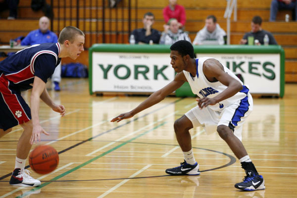 Senior guard, Eric Loury, goes to work on defense against Conant.
