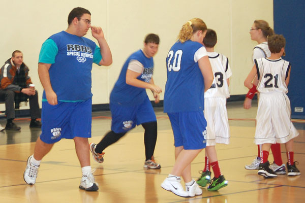 Special Olympics athlete Mike Habayeb (left) would claim his moment of fame at half-time with a jaw dropping half-court shot.