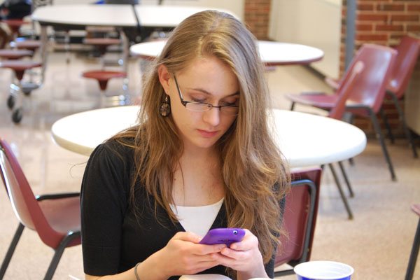 Junior Lindsey Dowling takes advantage of the new pilot program and checks her phone during lunch.