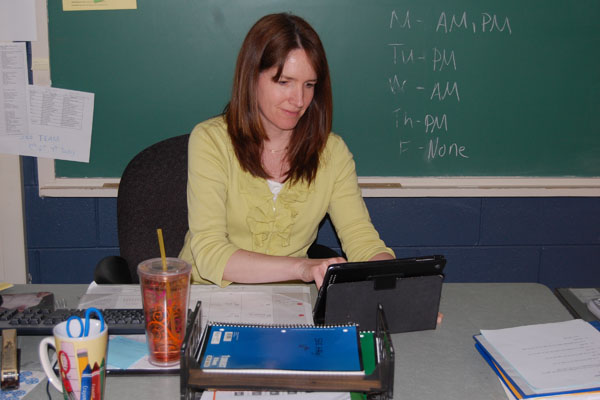 SEE Team Math Teacher Patty Young plans lessons and maintains her calendar on her iPad.  SEE Team's iPads are one of many new personal technology device inclusions at RB.