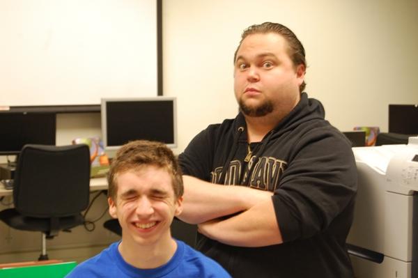 New auditorium manager Matt McConnell clowns around with senior tech crew member Findlay Ross.