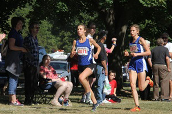 German exchange student, Mailin Struck, (right), leads the way for a stacked girls cross country team.