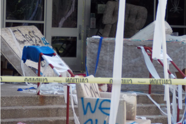 Vandalism at RBs old main entrance saw graffiti, mattresses, couches, and other items placed in front of the doors.