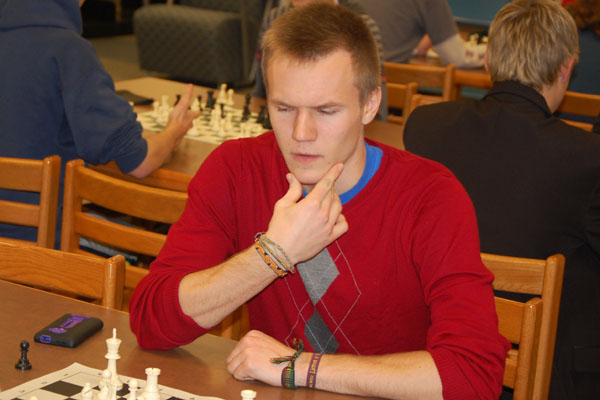 Chess Club member Vidas Kulbis thinks intensely about his next move.