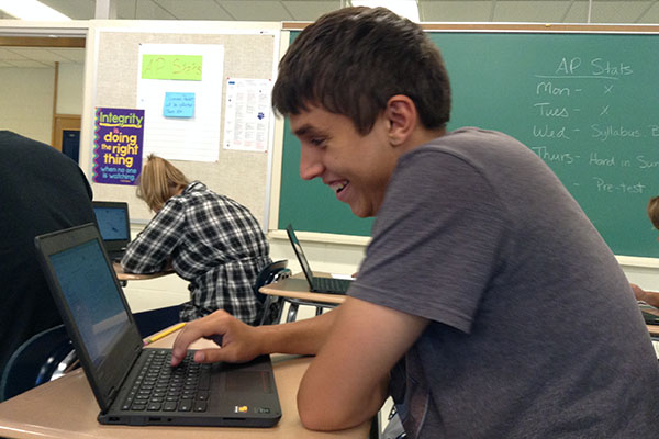 Joey Jones takes an online quiz in AP Stats using his Chromebook.  AP Stats was one of four pilot classes to receive the 1:1 devices this year.