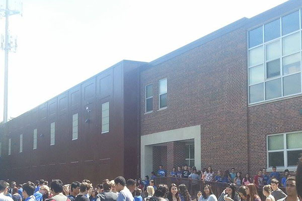 Students file out of school during an unannounced fire drill