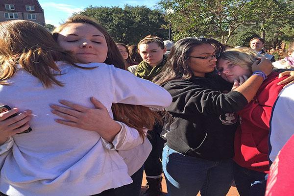 Students comfort each other the morning of Thursday, Nov. 20, 2014 after the previous night's shooting at Florida State University's Strozier Libarary in Tallahassee, Fla. (Kathleen McGrory/Miami Herald/TNS)
