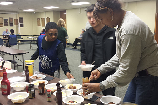 African American Cultural Association (AACA) sponsor Alison Jackson serves ice cream  to those who attended a  meeting with people who walked in Selma.