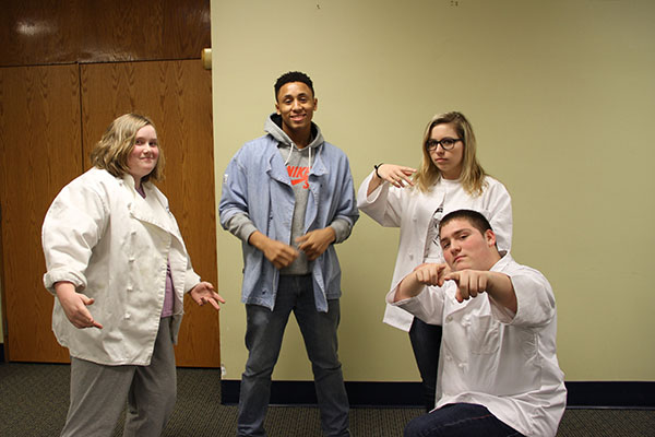 The students in the Hospitality Industry class take a break from preparing hors doeuvres for the Red Carpet Event for Bye, Bye Birdie to pose for a photo. From left to right: Juniors Ellie Richards and Amir Alvarado and Senior Julia Waterloo and Peter Fudacz. 