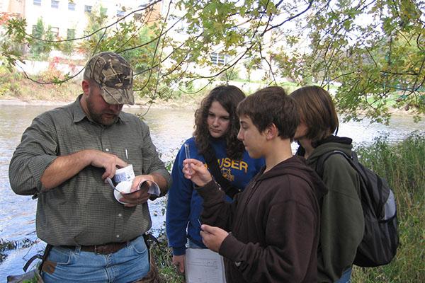 Biology teacher Jame Holt works with students in the early years of SEE team doing water quality testing.  Visit Clarions interactive timeline to see other memories of the team.