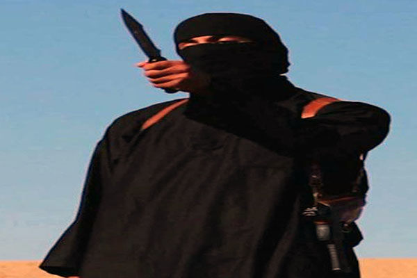 Mohammed Emwazi, a Kuwaiti-born man from London, has reportedly been identified as the masked man behind videos of ISIS beheadings. He's shown in this still from an ISIS video from September 14, 2014. (Ropi/Zuma Press/TNS)
