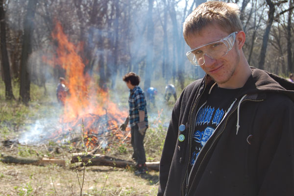 Day of Service students participate in a controlled prairie burn in 2014.  Event organizers hope to build off of last year's success.