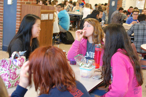 Seniors Grace Rasmussen, Ashley Lams, and Parley Belsey (from left) eat lunch.  