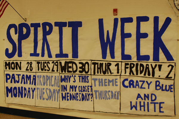 A mural hanging in the cafeteria listing what each spirit day is. 