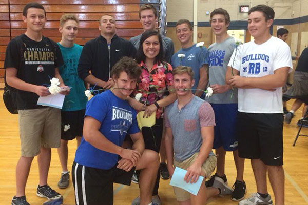 The top 10 nominees for boys homecoming court stand with nominee Silvana Alvarez. 