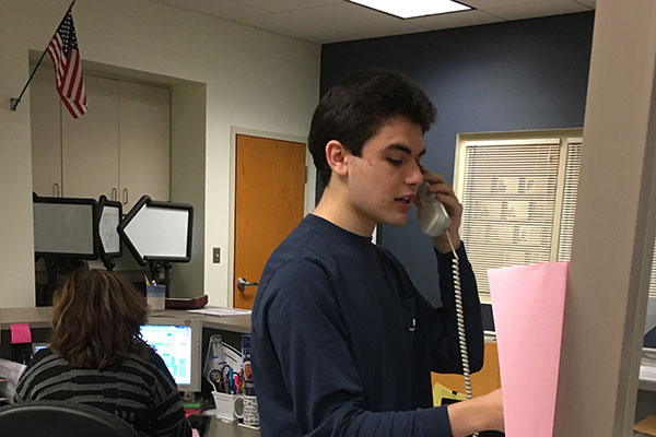 Senior Tom Loftus reading the morning announcements. 