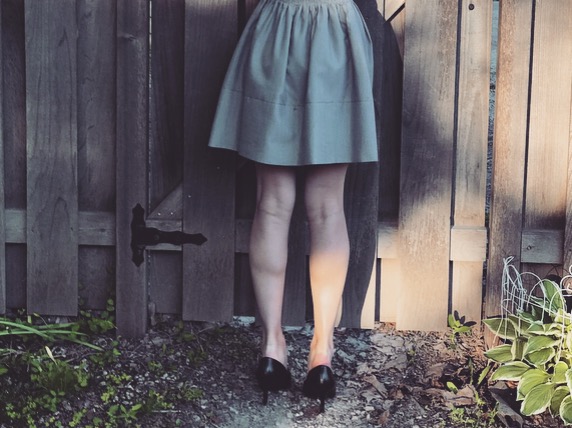 A student wearing a short skirt, violating school dress code. 