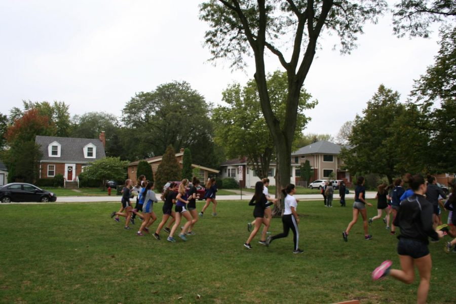 The RBHS girls cross country team practices before their upcoming conference meet.