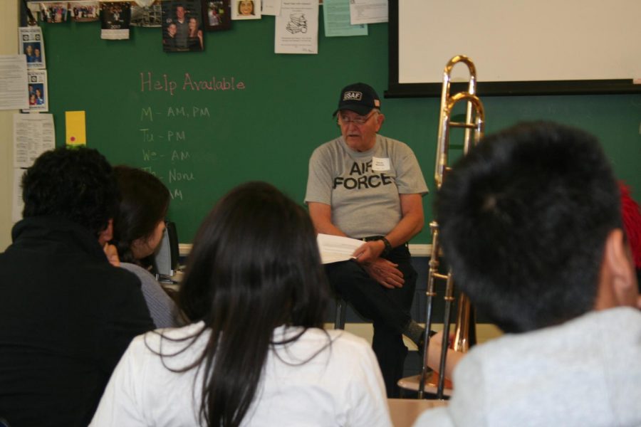 Dennis Martinek speaks to the class about his service. 