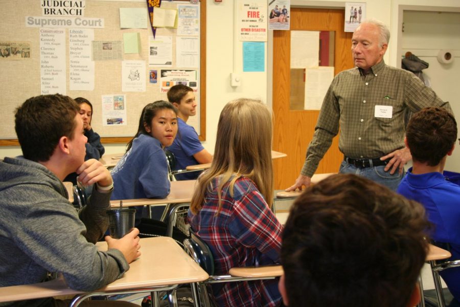 Richard Fields engaging with students in Rm. 231.