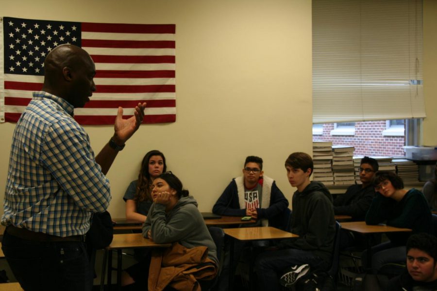 Students gather to listen to Charles St. Clair's stories.