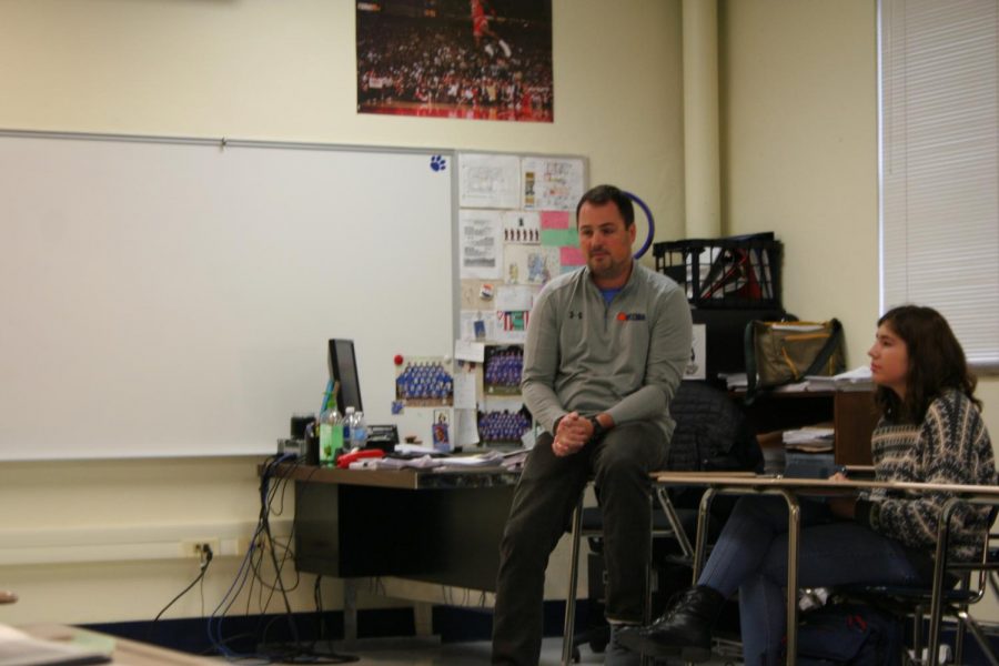 Kevin Turk talking to students in room 243.