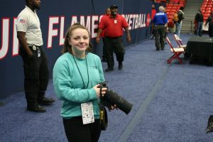 Photography Editor Hailey Paisker prepares to shoot photos at the Chicago Elite Basketball Tournament.