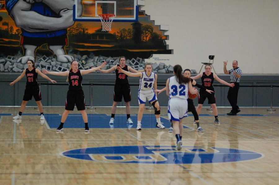 RB girls basketball players playing Glenbard East.