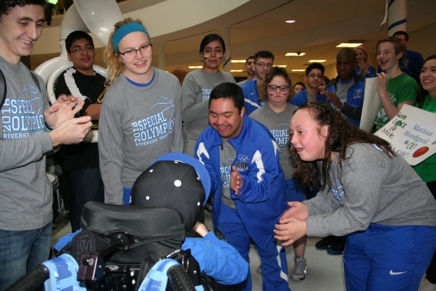 RB Special Olympics basketball team celebrates with the student body during their send off early Friday morning. 