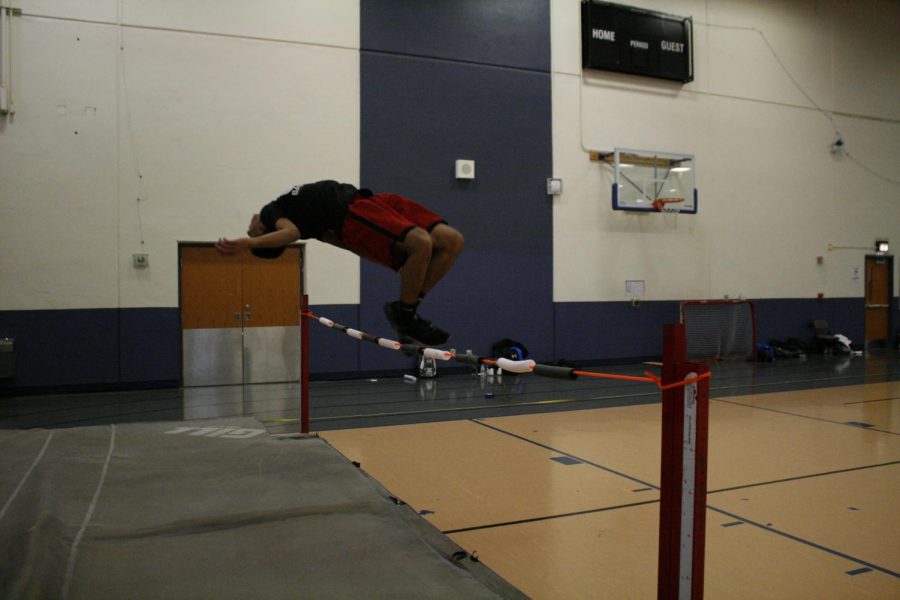 Devin Moody practices high jump.