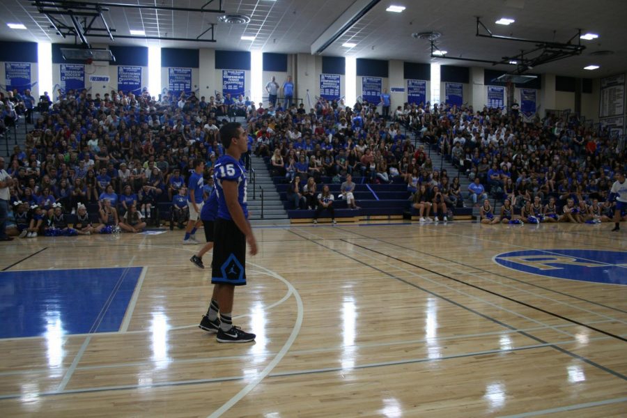 Students+play+dodge+ball+against+teachers+at+the+homecoming+pep+rally.