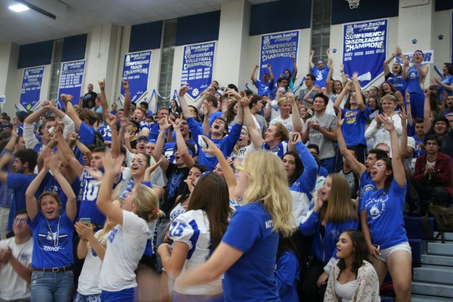 Students cheer during class competitions at the fall sports pep rally.