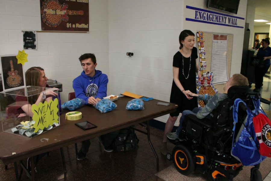 Students sold raffle tickets for a candy guitar and wristbands to benefit the All In For Ethan Foundation during lunch periods this week.
