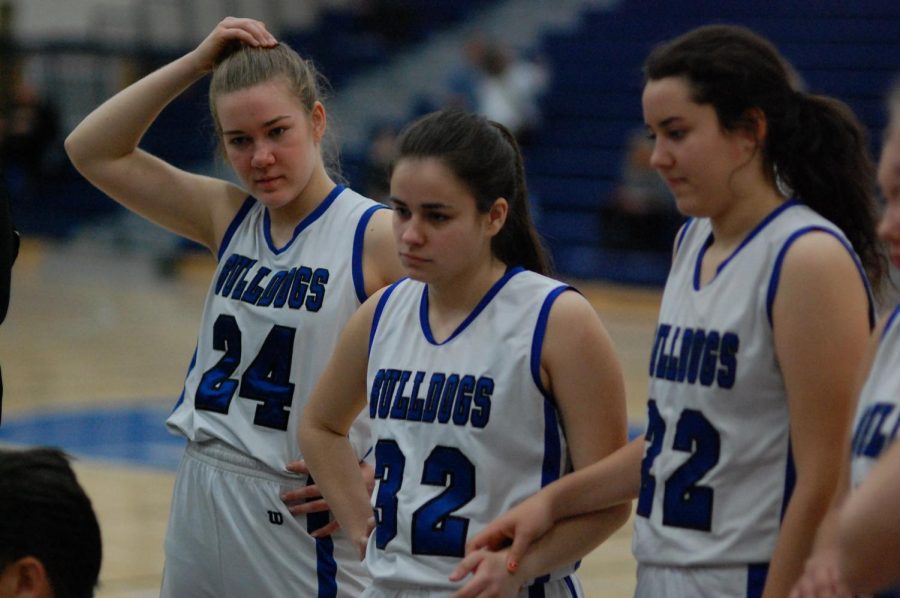 Mary Maloney (center) listening to coaches.