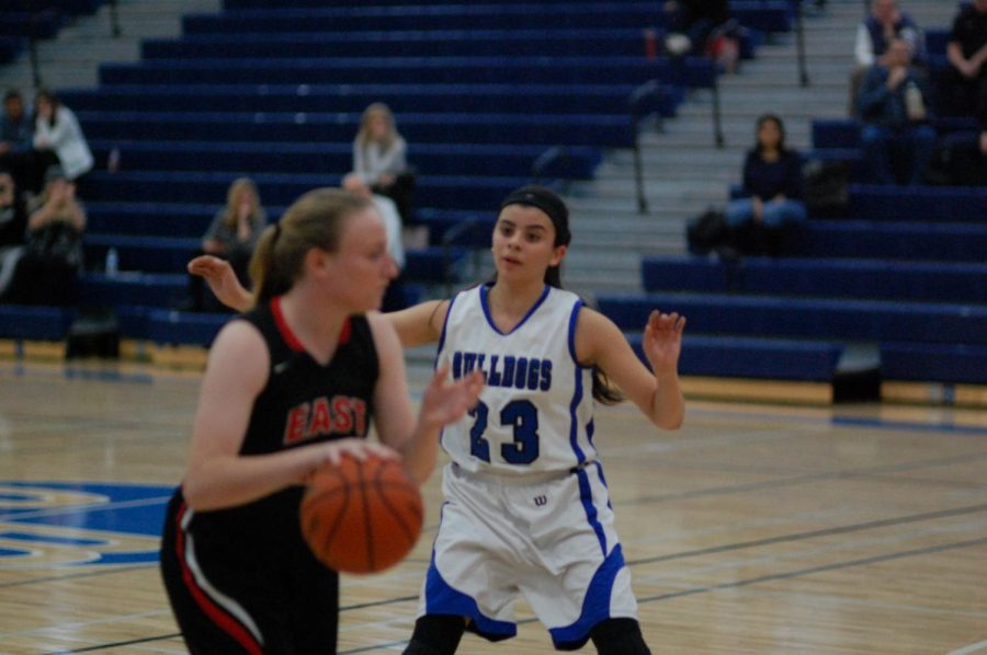 Angelina Ocampo (center) guards the opposing player.