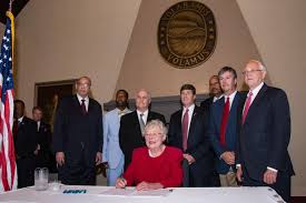 Alabama Gov. Kay Ivey signs restrictive abortion bill.