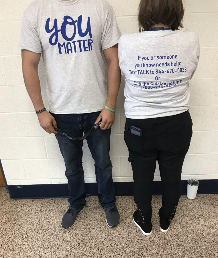 Social workers and administration wearing You matter shirts. 