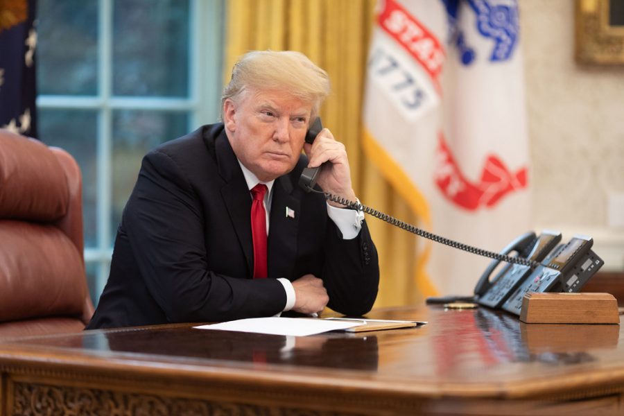 President Donald Trump on the phone in the Oval Office. Official White House photo by Joyce N. Boghosian