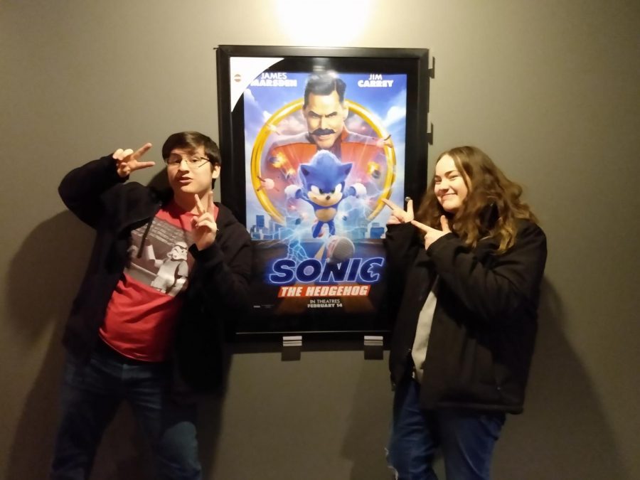 William+and+Mali+show+their+excitement+in+front+of+the+Sonic+Movie+poster.