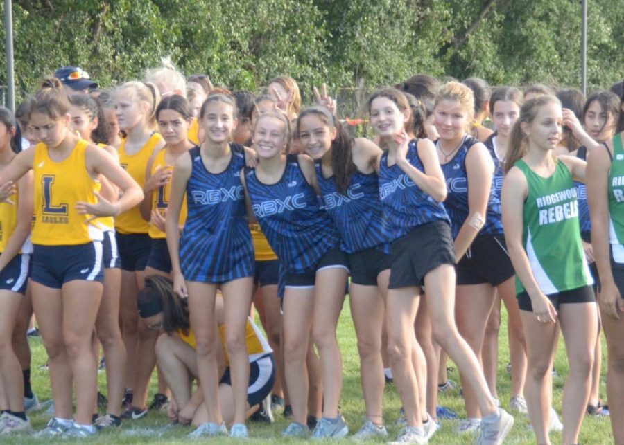 Molly Raymond, second from left,  has made many friends through the Cross Country team.