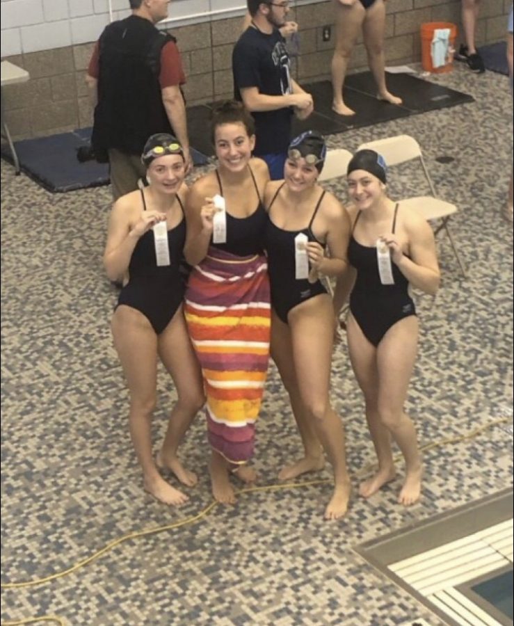 Perry (fourth from the left) with her teammates, from left to right, Paige Deason, Morgan Daun and Noelle Harazin.