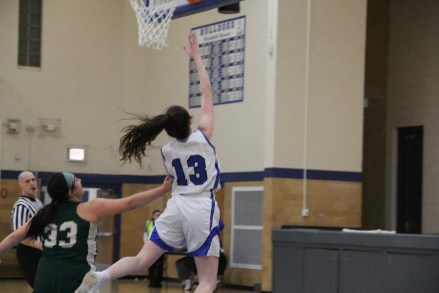 Junior Brenna Loftus going up for a layup.              
‎‏‏‎ ‎‏‏‎ ‎‏‏‎ ‎‏‏‎ ‎‏‏‎ ‎‏‏‎ ‎Photo courtesy of Rouser.