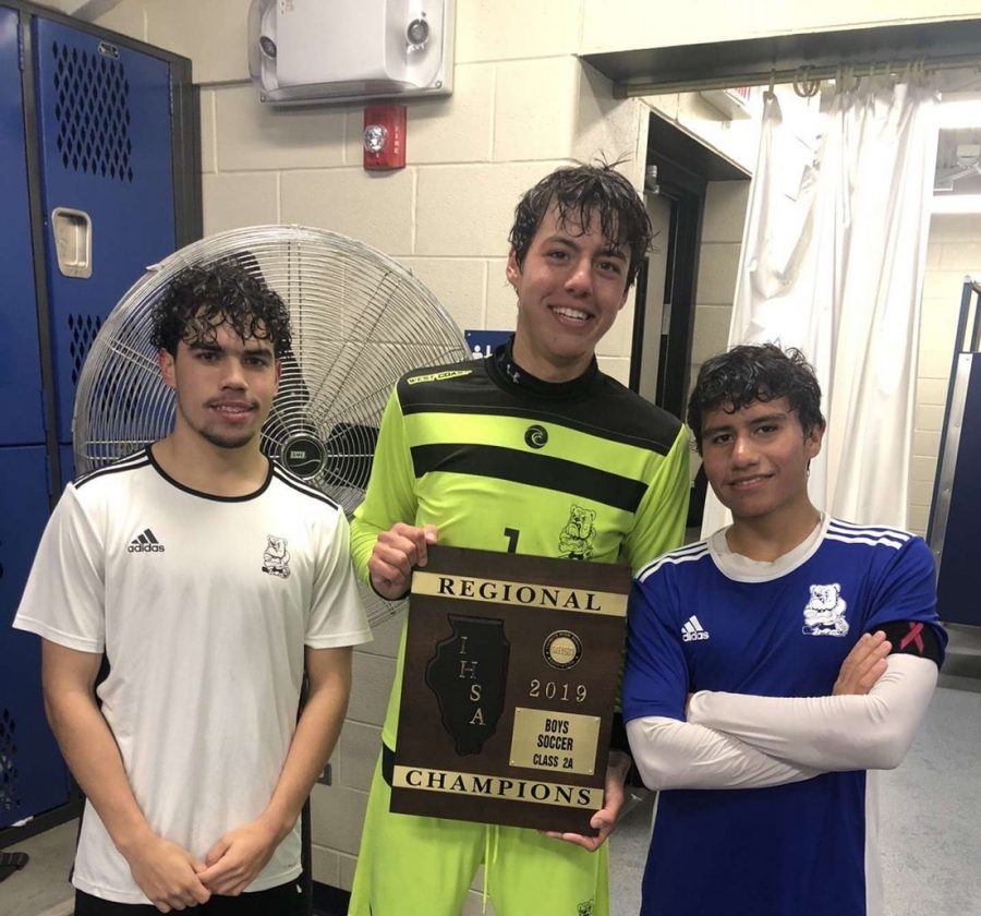 Daniel Sessler, center, celebrating the teams regionals win.